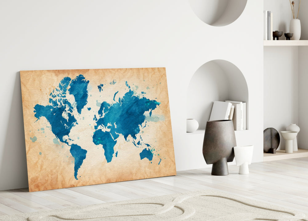 Close-up detail of cobalt watercolour continents behind glass