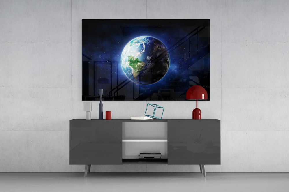 Earth glass wall art catching light to reveal its painted cobalt oceans