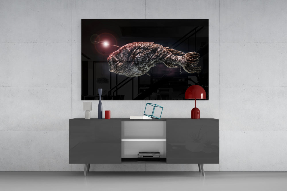 Deepsea Fish glass wall art catching light to reveal its painted rust-silver scales