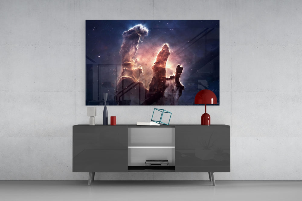 Space Clouds glass wall art catching light to reveal its painted nebula tones
