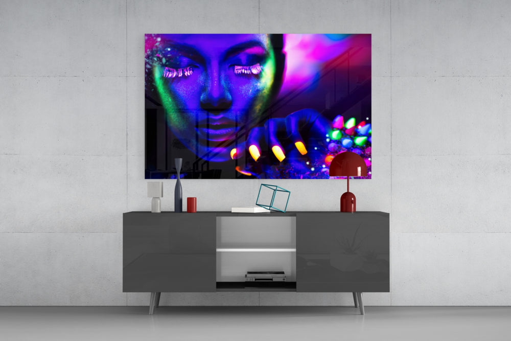 Neon Woman glass wall art catching light to reveal its painted UV pigments