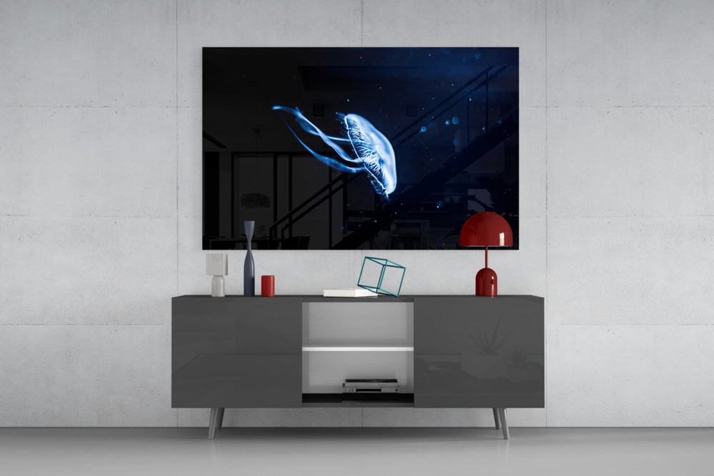 Jellyfish glass wall art catching light to reveal its painted cobalt glow