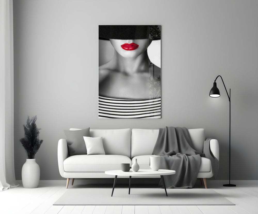 Close-up detail of crimson lips and Breton stripes behind glass