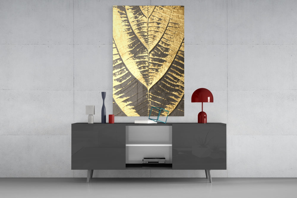 Golden Leaf glass wall art catching light to reveal its painted gilded foil