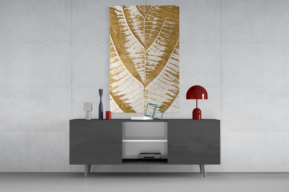 Golden Leaf glass wall art catching light to reveal its painted gilded foil