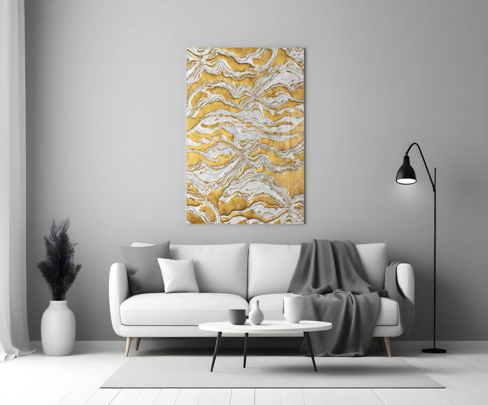 Close-up detail of ivory impasto crests on gold behind glass