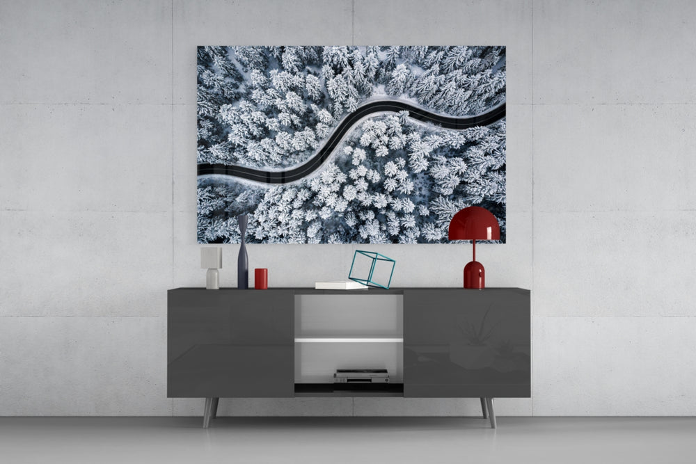 Forest Landscape glass wall art catching light to reveal its painted cool snow tones