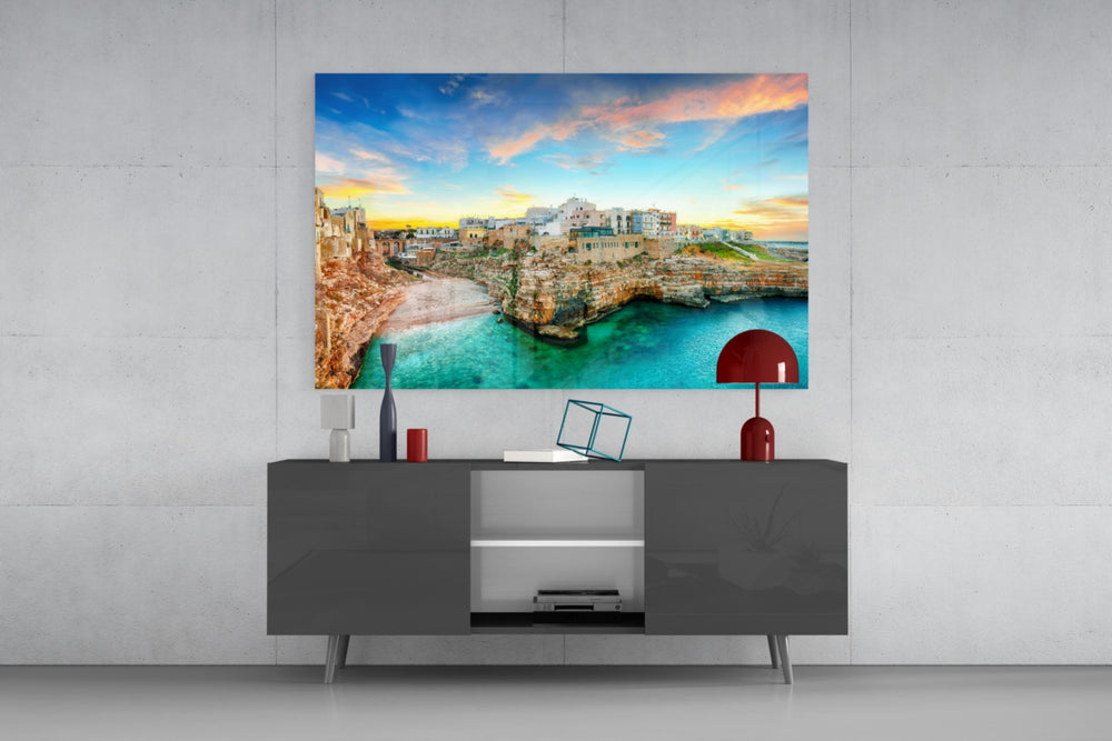 Jules Verne glass wall art catching light to reveal its painted sunset tones