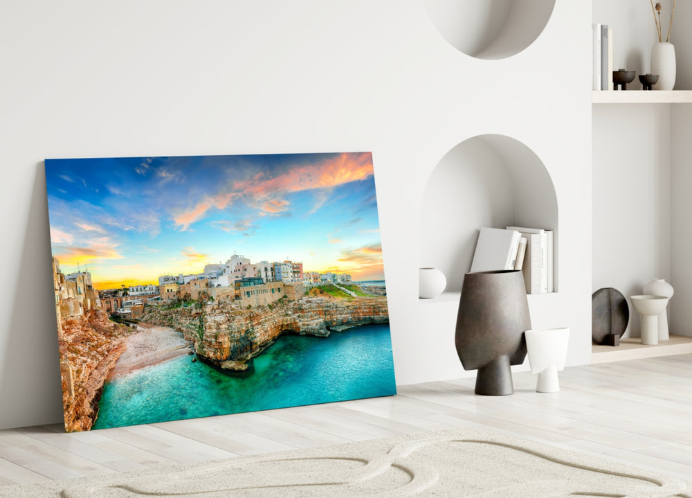 Close-up detail of limestone cliffs and turquoise cove behind glass