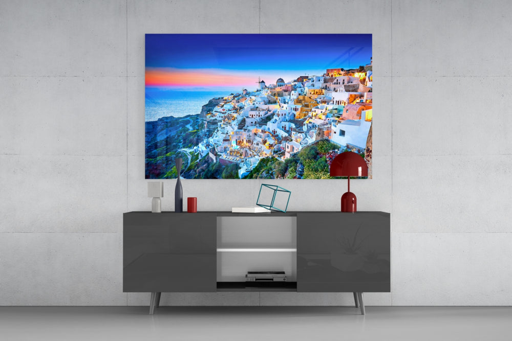 Santorini glass wall art catching light to reveal its painted sunset tones