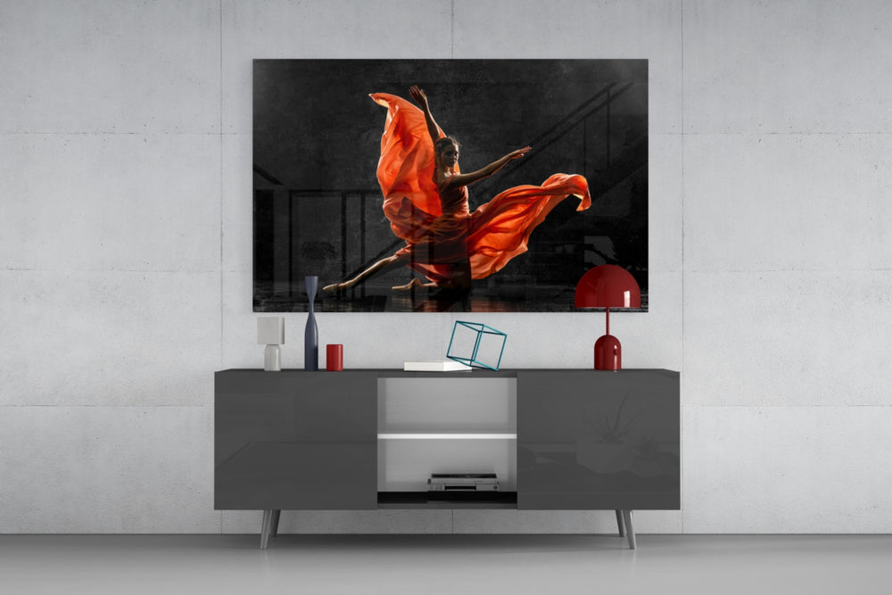 Ballet glass wall art catching light to reveal its painted scarlet silk
