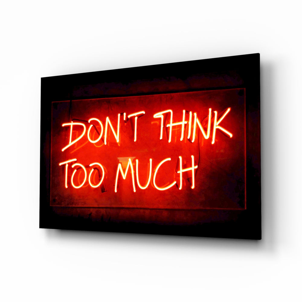 Don't Think Too Much glass wall art in a modern creative loft