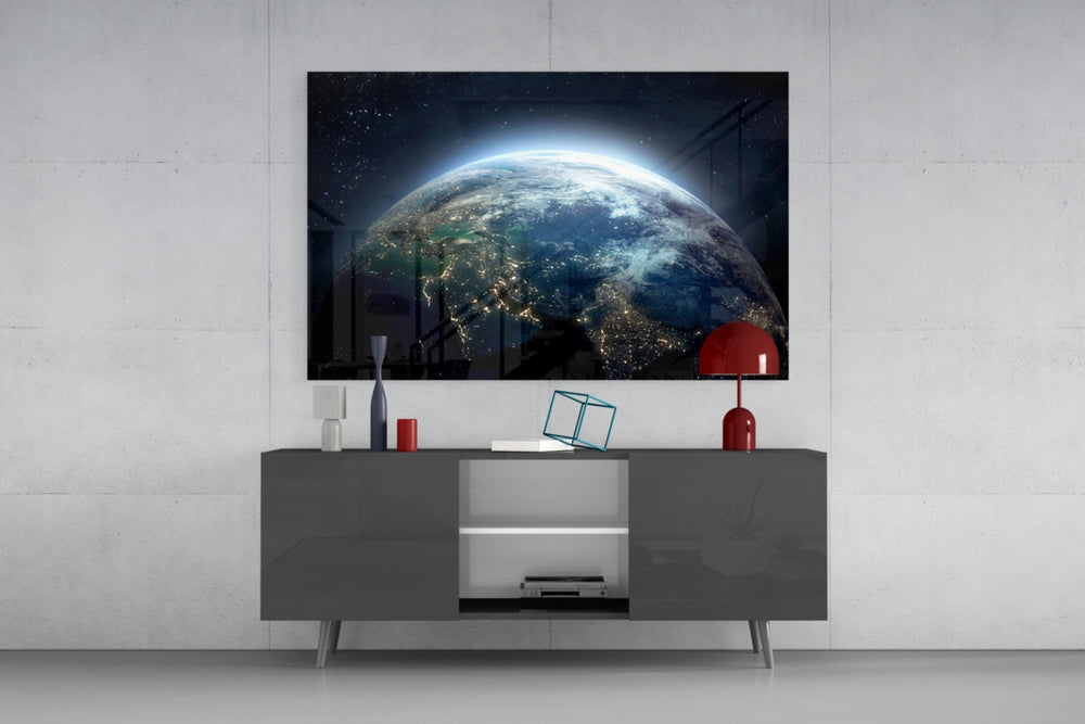 World glass wall art catching light to reveal its painted city-light tones
