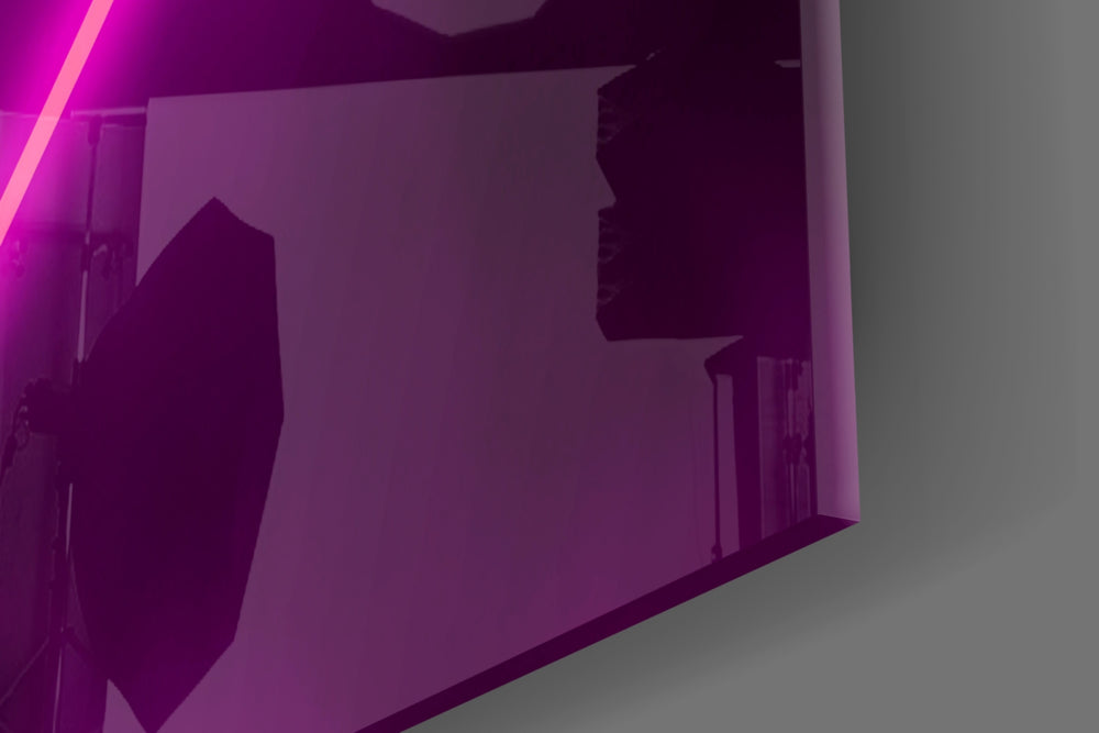 Abstract Art glass wall art catching light to reveal its painted magenta neon