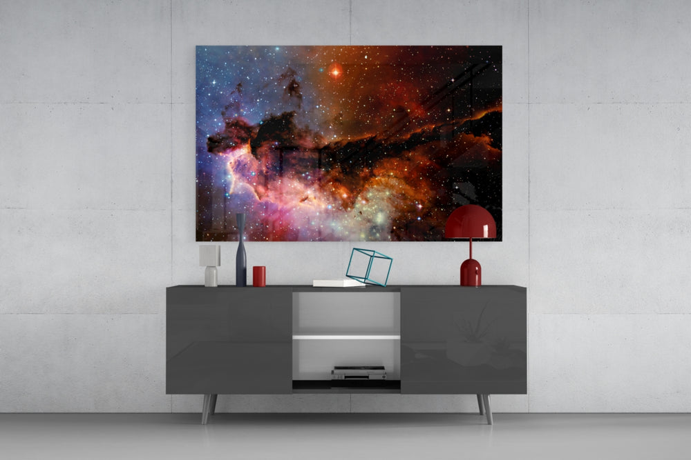 World Of The Galaxy glass wall art catching light to reveal its painted nebula tones