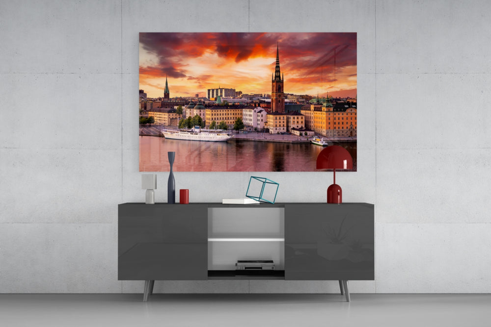 Stockholm glass wall art catching light to reveal its painted scarlet sky