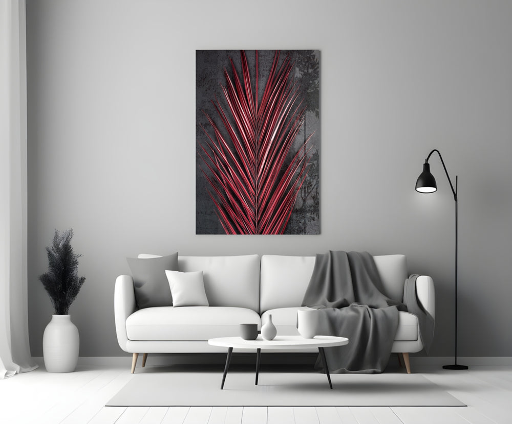 Close-up detail of crimson palm-frond leaflets behind glass