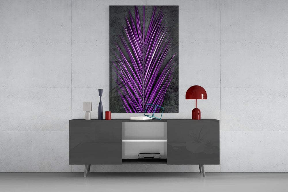 Areca Bunch glass wall art catching light to reveal its painted violet frond