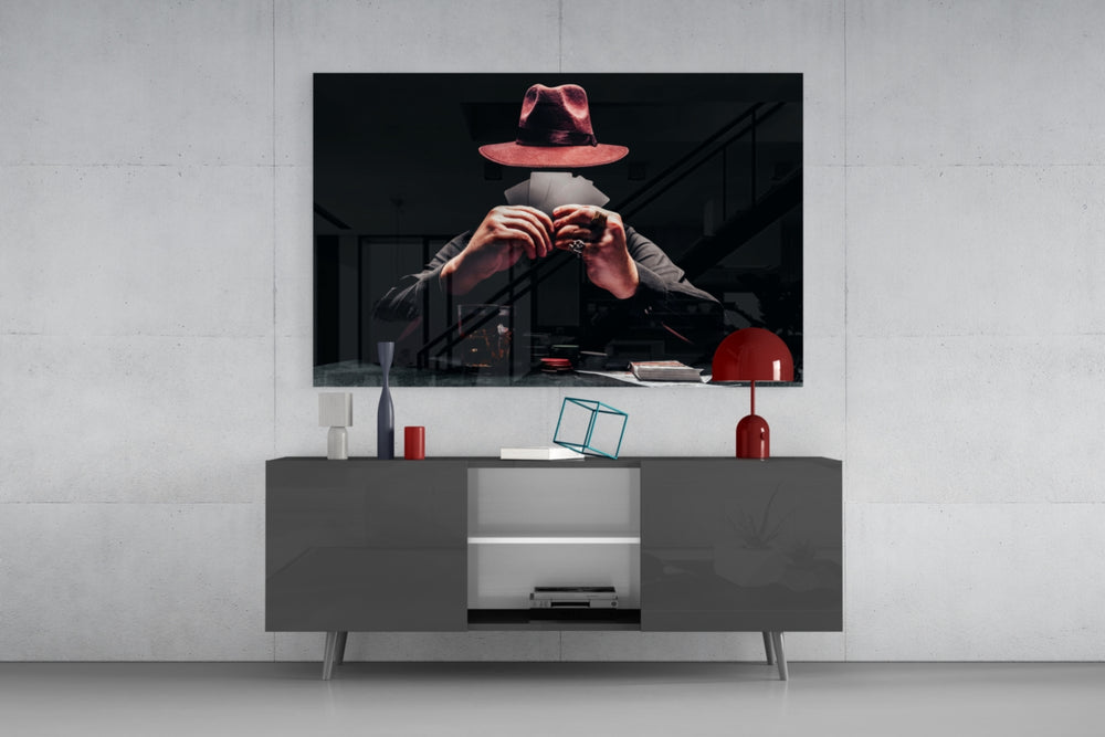 The Mysterious Gambler glass wall art catching light to reveal its painted noir tones