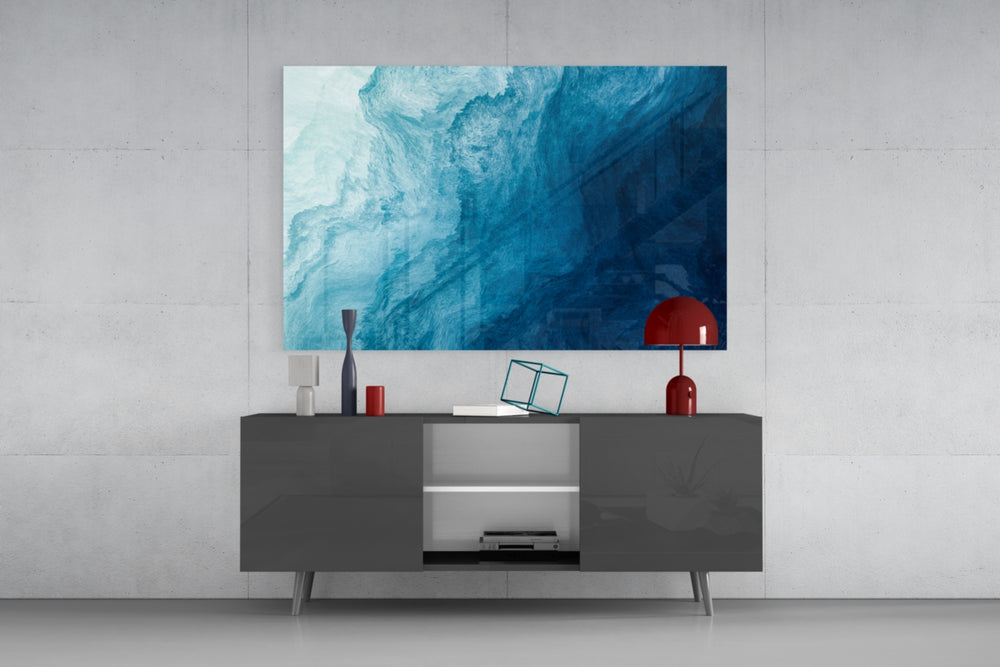 Shades Of Blue glass wall art catching light to reveal its painted blue washes