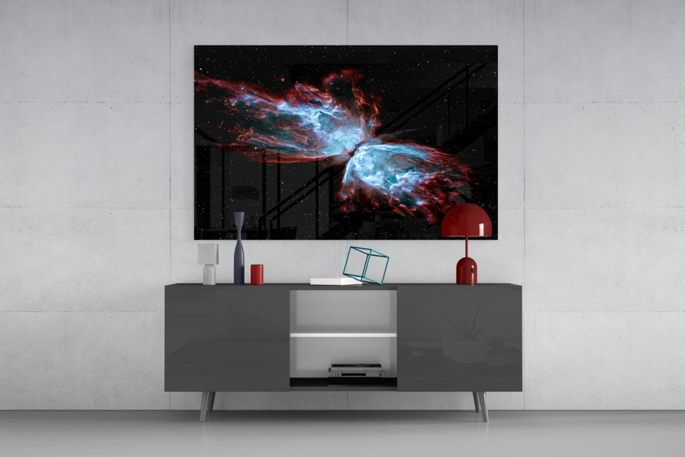 Space Red glass wall art catching light to reveal its painted nebula wings