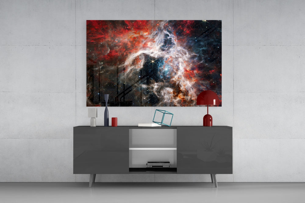 Space glass wall art catching light to reveal its painted nebula tones