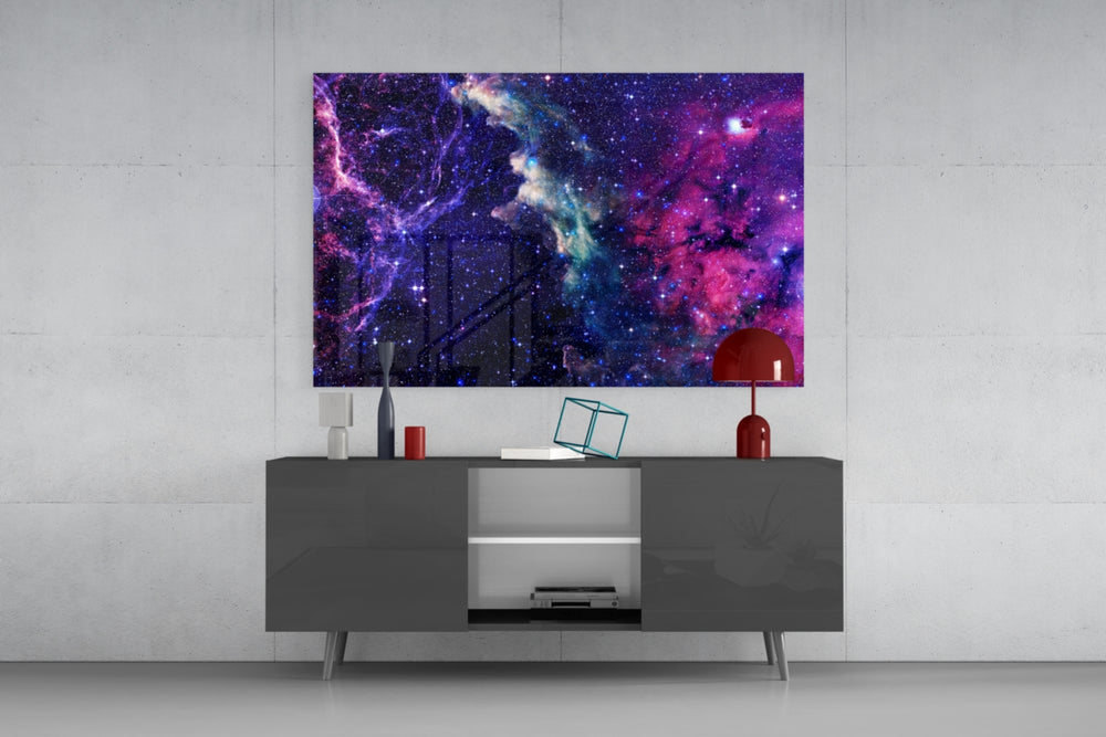 Space Purple glass wall art catching light to reveal its painted nebula