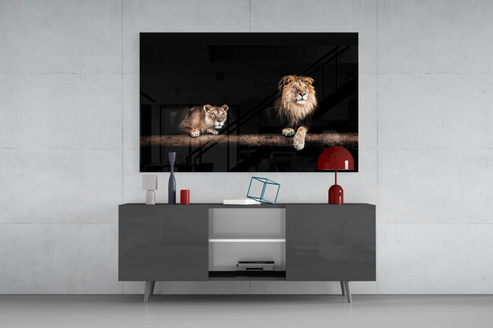 Leo Family glass wall art catching light to reveal its painted lion family