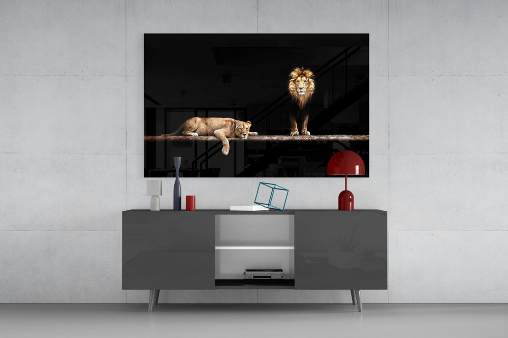 Leo Family glass wall art catching light to reveal its painted lion family