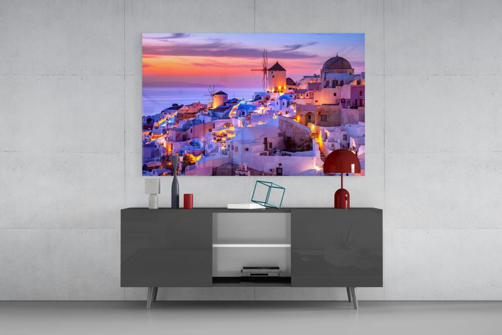 Santorini glass wall art catching light to reveal its painted lilac sky