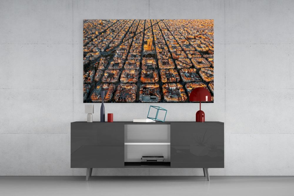 Barcelona glass wall art catching light to reveal its painted aerial grid