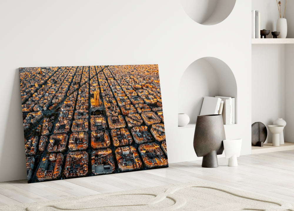 Close-up detail of Eixample chamfered blocks and Sagrada Família behind glass