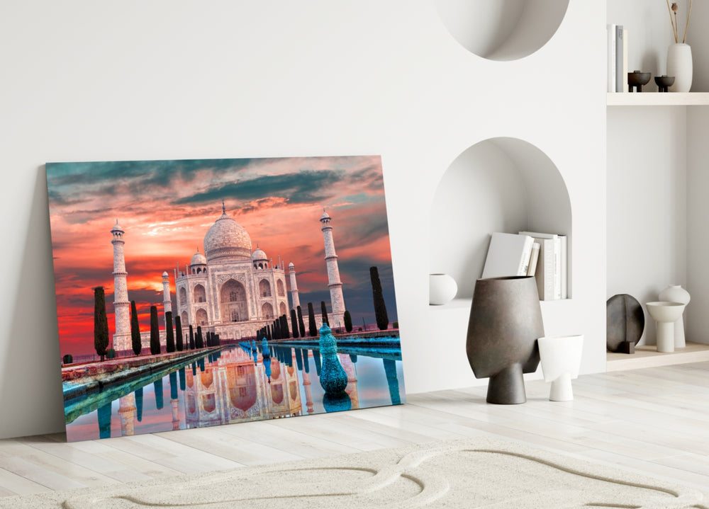 Close-up detail of scarlet sunset and Taj reflection behind glass
