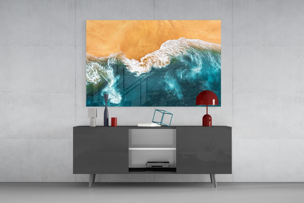Waves glass wall art catching light to reveal its painted shoreline tones