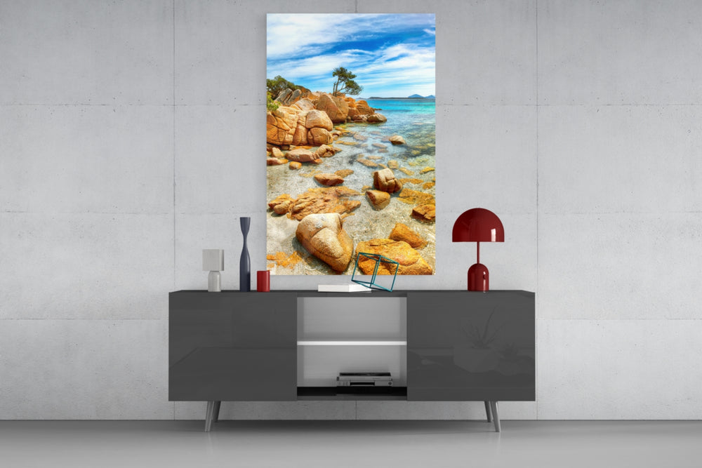 Beach View glass wall art catching light to reveal its painted lichen rocks
