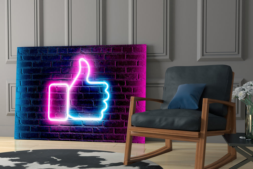 Pink-and-blue neon Like cinematic glass wall art over gamer desk