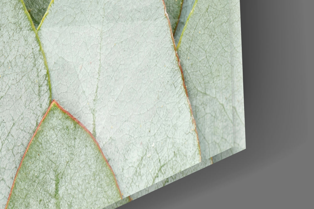 Sage-and-copper leaf cinematic glass wall art over modern dining sideboard