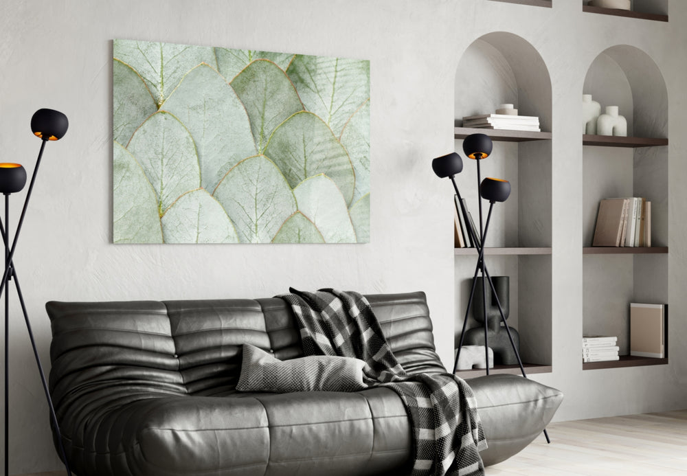 Pale-mint leaves cinematic glass wall art over master-bedroom headboard