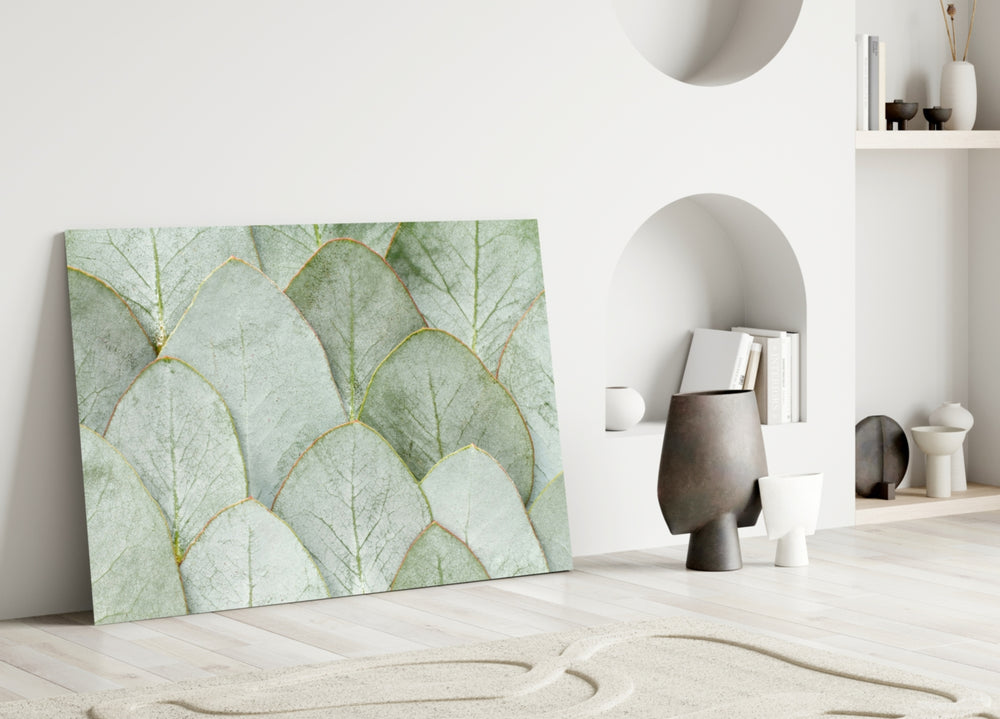 Botanical leaf-stack cinematic glass wall art in boutique cafe entry