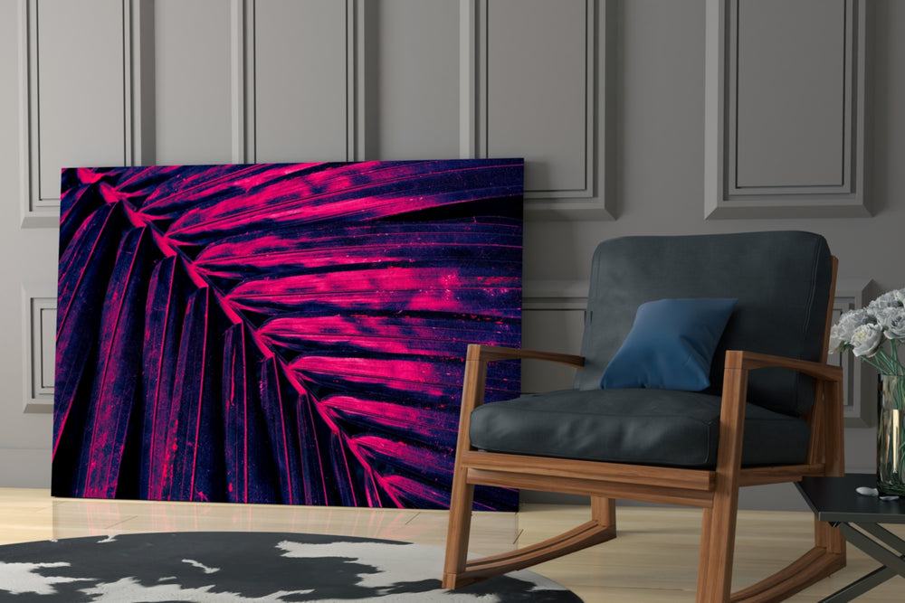 Stage-lit palm cinematic glass wall art over master-bedroom headboard