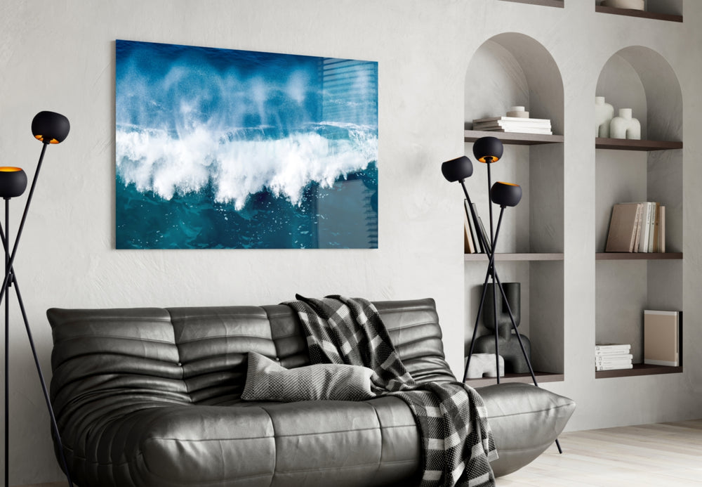 Cobalt-foam wave cinematic glass wall art in hospitality lounge