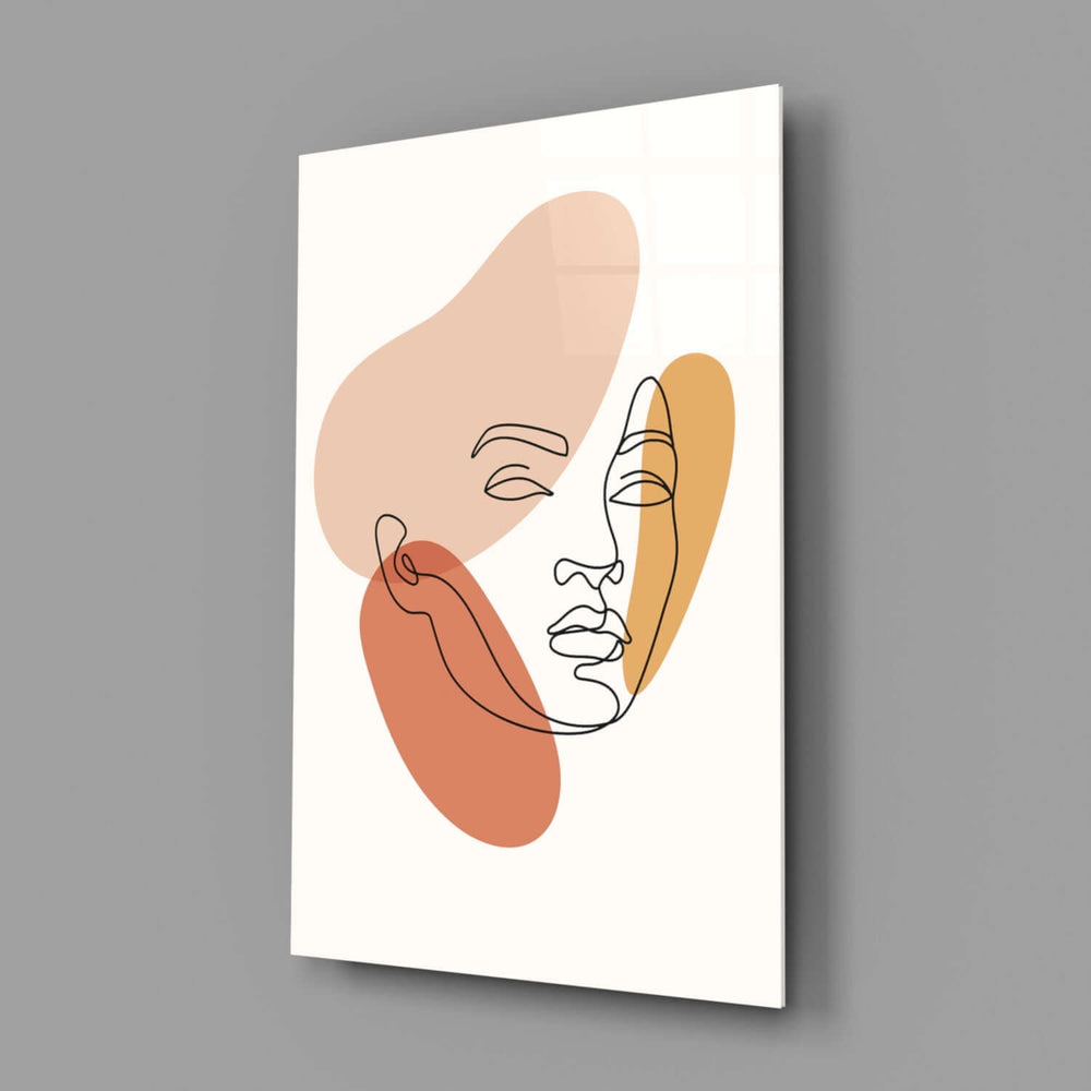Matisse-style split-tone face cinematic glass wall art in wellness studio reception
