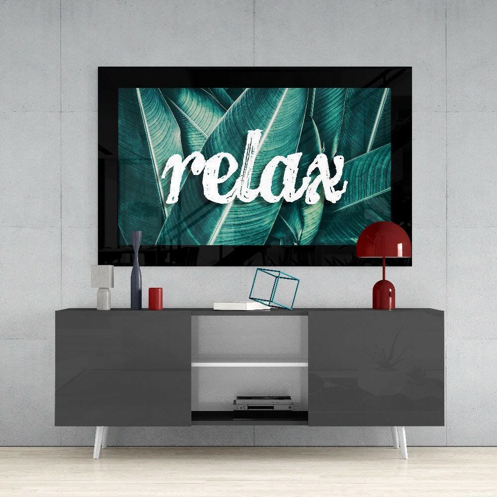 Calm glass wall art styled above a console in a reading nook