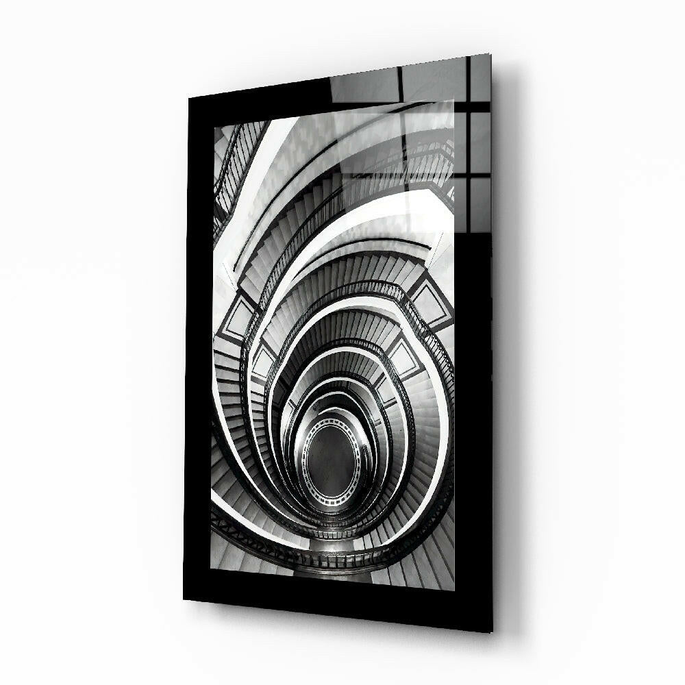 Spiral Stairs glass wall art displayed above a console in an entryway