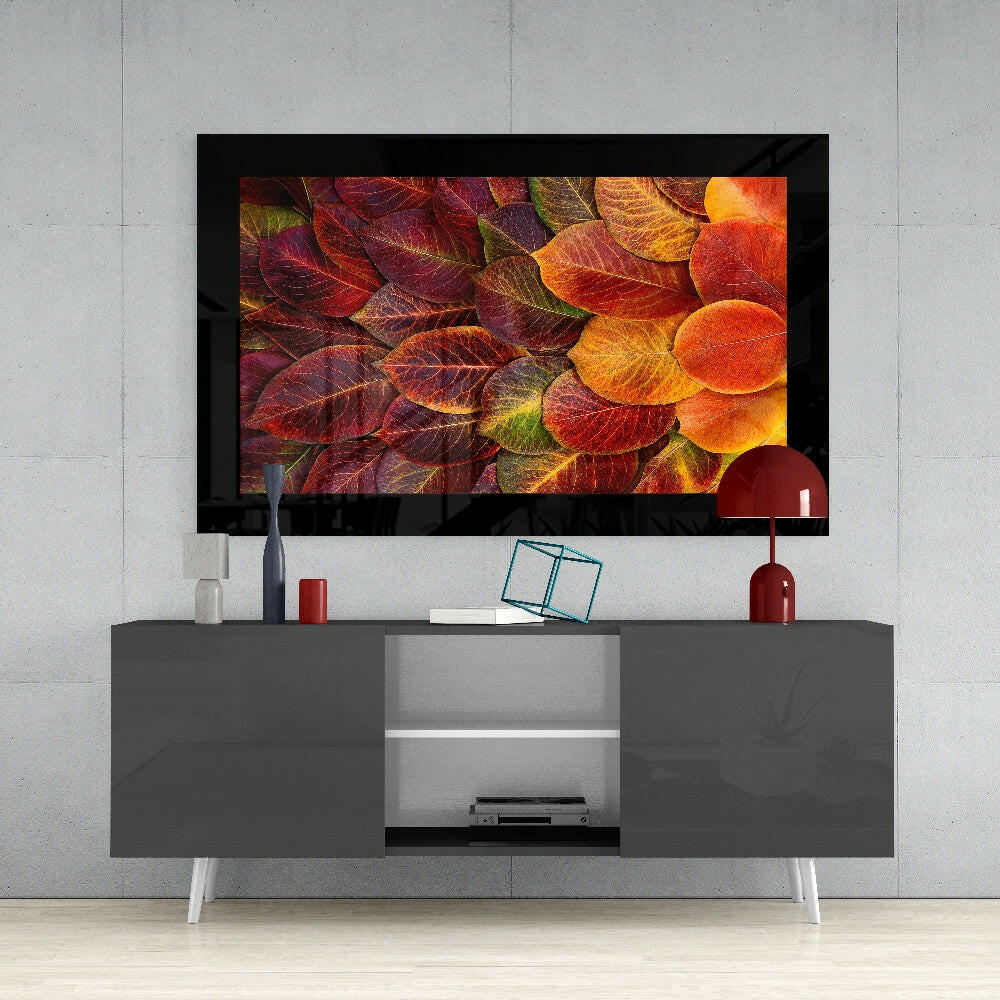 Autumn Leaves glass wall art styled above a console in a reading nook