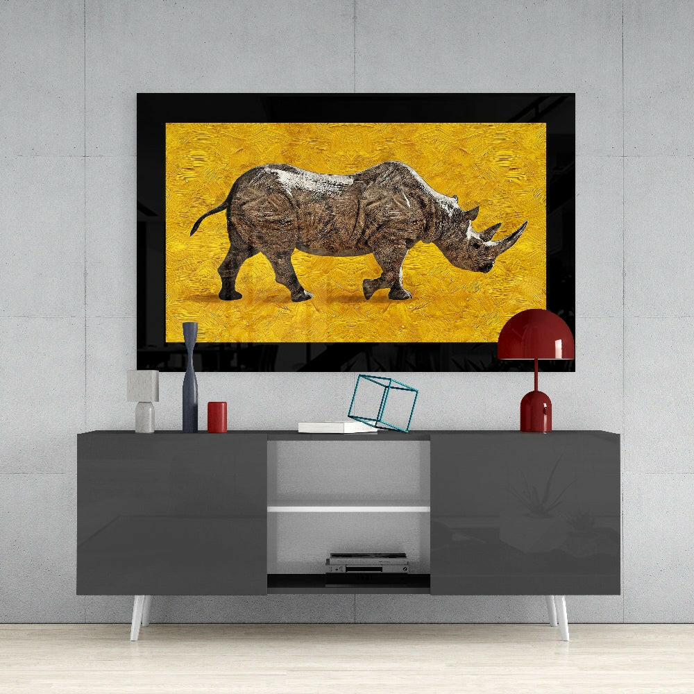 Rhino glass wall art styled above a console in a library