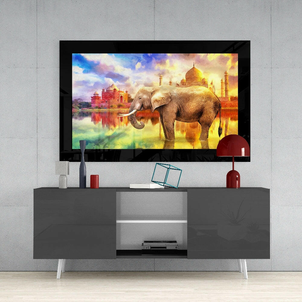 Elephant glass wall art styled above a console in a reading nook