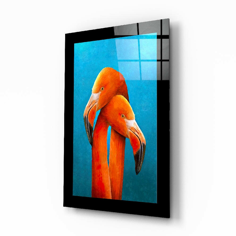 Flamingos glass wall art displayed above a bed in a bedroom