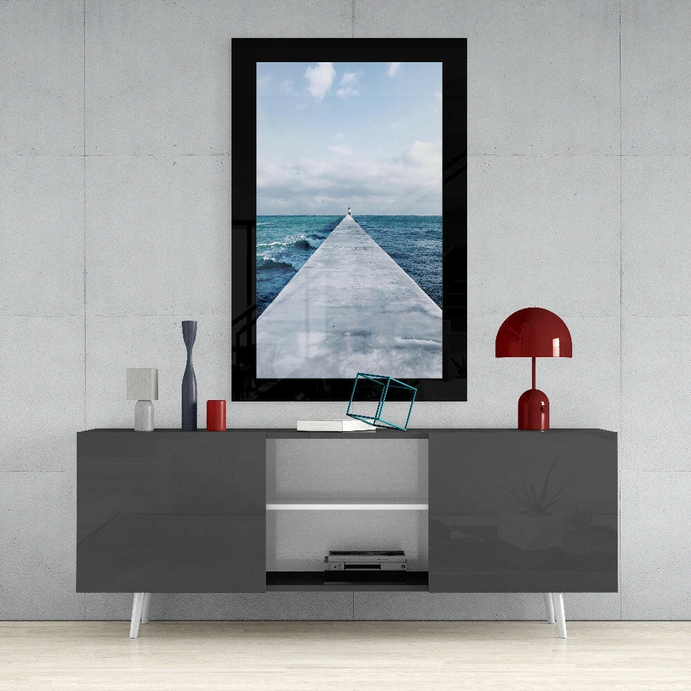 Far Horizon glass wall art styled above a console in a coastal cottage