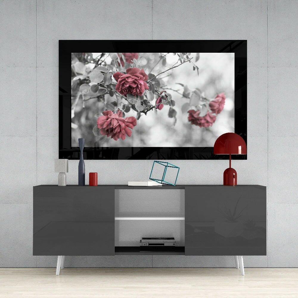 Rosewood glass wall art styled above a console in a reading nook